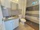 Bathroom featuring a tile shower, white vanity with granite countertops at 1226 W Purdue Ave, Phoenix, AZ 85021