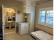 Bedroom with closet space and a view into the bathroom and lots of light at 1226 W Purdue Ave, Phoenix, AZ 85021