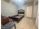 This is a bedroom with tile flooring, and large sliding door closets at 1226 W Purdue Ave, Phoenix, AZ 85021