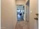 Hallway leading into a kitchen with tile floors at 1226 W Purdue Ave, Phoenix, AZ 85021