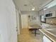 Cozy kitchenette features a breakfast table and classic tile flooring at 1226 W Purdue Ave, Phoenix, AZ 85021