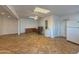 Open-concept living room with tiled floor, ceiling fan, and neutral paint at 1226 W Purdue Ave, Phoenix, AZ 85021