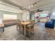 Open floor plan with a dining table, kitchen and several seating areas at 1226 W Purdue Ave, Phoenix, AZ 85021