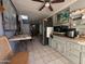View of the kitchen with gray cabinets and tile floors at 1226 W Purdue Ave, Phoenix, AZ 85021