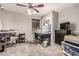 Functional bedroom with a sewing station, desk, and natural light at 12325 W Berridge Ln, Litchfield Park, AZ 85340