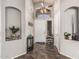 Inviting foyer with decorative shelving and tiled floor at 12325 W Berridge Ln, Litchfield Park, AZ 85340