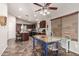 The eat-in kitchen with island, stainless steel appliances, and tiled flooring at 12325 W Berridge Ln, Litchfield Park, AZ 85340