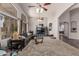 Bright living room featuring high ceilings, carpet, and archways to other rooms at 12325 W Berridge Ln, Litchfield Park, AZ 85340