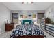 A comfortable main bedroom boasts a ceiling fan and a soothing color palette at 12325 W Berridge Ln, Litchfield Park, AZ 85340