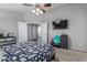 A comfortable main bedroom boasts a ceiling fan and a soothing color palette at 12325 W Berridge Ln, Litchfield Park, AZ 85340