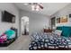 A comfortable main bedroom boasts a ceiling fan and a soothing color palette at 12325 W Berridge Ln, Litchfield Park, AZ 85340