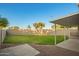 Large backyard with grass and stone; a perfect space for Gathering gatherings and outdoor activities at 1405 N Jamaica Way, Gilbert, AZ 85234