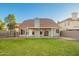 This home features a spacious, well-maintained backyard with a covered patio, perfect for outdoor entertaining at 1405 N Jamaica Way, Gilbert, AZ 85234