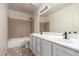 Bathroom featuring a double vanity, bathtub, and tile flooring at 1405 N Jamaica Way, Gilbert, AZ 85234