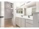 Bright bathroom with double sinks, white cabinets, and modern fixtures at 1405 N Jamaica Way, Gilbert, AZ 85234