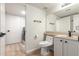 Bathroom showcasing a toilet and vanity near a laundry area at 1405 N Jamaica Way, Gilbert, AZ 85234