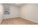 Cozy bedroom with wood floors and bright window at 1405 N Jamaica Way, Gilbert, AZ 85234