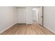 Bright bedroom featuring wood-look flooring and a closet with bi-fold doors at 1405 N Jamaica Way, Gilbert, AZ 85234