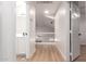 Second-floor hallway with wood-look floors and a view of the bathroom and upstairs area at 1405 N Jamaica Way, Gilbert, AZ 85234