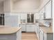Bright kitchen with white appliances, countertops, and cabinetry at 1405 N Jamaica Way, Gilbert, AZ 85234