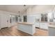 Bright kitchen with white cabinets, breakfast nook, and island at 1405 N Jamaica Way, Gilbert, AZ 85234