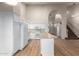 Bright kitchen with staircase, white cabinets and island at 1405 N Jamaica Way, Gilbert, AZ 85234