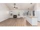 Bright living room featuring a fireplace, fan and wood-look floors at 1405 N Jamaica Way, Gilbert, AZ 85234