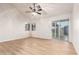 Spacious living room with vaulted ceiling, wood floors, and natural light at 1405 N Jamaica Way, Gilbert, AZ 85234