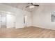 Open-concept living area with wood floors and access to multiple rooms at 1405 N Jamaica Way, Gilbert, AZ 85234