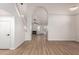 Bright living room with wood floors, high ceilings, and lots of natural light from multiple windows at 1405 N Jamaica Way, Gilbert, AZ 85234