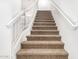 Carpeted staircase with white railings at 1405 N Jamaica Way, Gilbert, AZ 85234