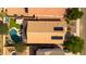 Overhead view of property showing the roof, backyard pool, patio area, desert landscaping, and nearby homes at 1432 E Penny Ln, San Tan Valley, AZ 85140