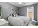 Well-lit bedroom with a queen-sized bed, neutral colors, and decorative accents for a cozy feel at 1432 E Penny Ln, San Tan Valley, AZ 85140