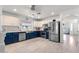 Modern kitchen featuring stainless steel appliances, two-tone cabinetry, and plenty of counter space at 1432 E Penny Ln, San Tan Valley, AZ 85140