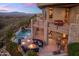 Outdoor space with lounge seating, fire pit, grill, and private pool overlooking desert landscape at 15054 E Sundown Dr, Fountain Hills, AZ 85268