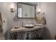 Bathroom showcasing a stone countertop, decorative mirror, and unique fixtures at 15054 E Sundown Dr, Fountain Hills, AZ 85268