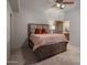 This bedroom features carpet flooring, neutral decor, and an ensuite bathroom at 15054 E Sundown Dr, Fountain Hills, AZ 85268