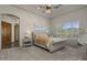 Bedroom with tray ceilings, neutral decor, plantation shutters, and carpet flooring at 15054 E Sundown Dr, Fountain Hills, AZ 85268