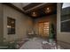 Inviting entryway with double doors, seating, and stone accents at 15054 E Sundown Dr, Fountain Hills, AZ 85268