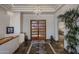 Grand entryway with stone floors, wood double doors and view to main bedroom at 15054 E Sundown Dr, Fountain Hills, AZ 85268