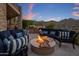 Cozy fire pit area with comfortable seating and a built-in grill at 15054 E Sundown Dr, Fountain Hills, AZ 85268