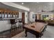 Entertainment room offering bar seating, a billiard table, and an inviting seating area at 15054 E Sundown Dr, Fountain Hills, AZ 85268