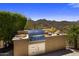 Outdoor kitchen with built-in grill, counter space, and storage, perfect for alfresco dining with mountain views at 15054 E Sundown Dr, Fountain Hills, AZ 85268