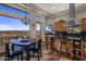 Eat-in kitchen with black countertops, stainless steel appliances, island and breakfast nook at 15054 E Sundown Dr, Fountain Hills, AZ 85268