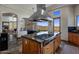 Open-concept kitchen with island, views of the mountains, and access to other rooms at 15054 E Sundown Dr, Fountain Hills, AZ 85268