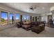 The luxurious living room features comfortable seating, carpet flooring, and scenic views at 15054 E Sundown Dr, Fountain Hills, AZ 85268