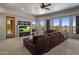 Inviting living room with large windows, comfortable seating, a ceiling fan, and beautiful views at 15054 E Sundown Dr, Fountain Hills, AZ 85268