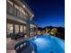 Luxury home's outdoor oasis with a sparkling pool, spa, fire pit, and stunning views under a starry night at 15054 E Sundown Dr, Fountain Hills, AZ 85268