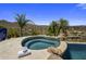 Relaxing spa with rock accents and scenic desert views, creating a serene outdoor retreat at 15054 E Sundown Dr, Fountain Hills, AZ 85268