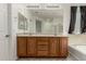 Bathroom featuring double vanity, tub, and shower with tile flooring at 15429 W Ventura St, Surprise, AZ 85379